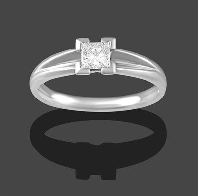 Lot 2172 - A Platinum Diamond Solitaire Ring, the princess cut diamond in a four claw setting, to V-shaped...