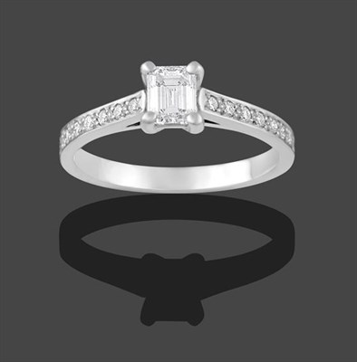 Lot 2173 - A Platinum Diamond Solitaire Ring, the emerald-cut diamond in a four claw setting, to round...