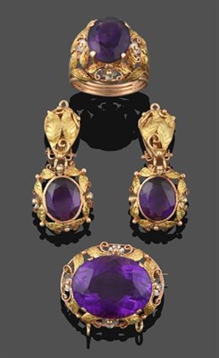 Lot 2189 - An Amethyst Ring, the round cut amethyst in a yellow claw setting, within a tri-colour foliate...