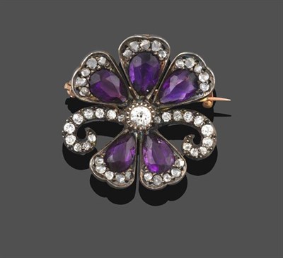 Lot 2200 - An Edwardian Amethyst and Diamond Brooch/Pendant, in the form of a flower, an old cut diamond...
