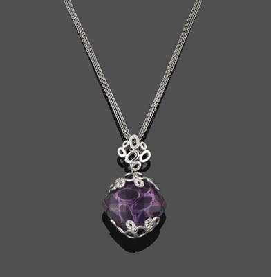 Lot 2206 - An Amethyst and Diamond Pendant on Chain, the fancy cut amethyst within a white multi-hoop cup...