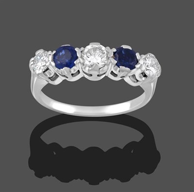 Lot 2213 - A Sapphire and Diamond Five Stone Ring, three round brilliant cut diamonds alternate with two round