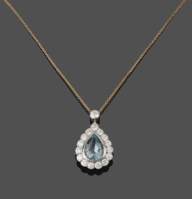 Lot 2218 - An Aquamarine and Diamond Cluster Pendant on Chain, the pear cut aquamarine within a border of...