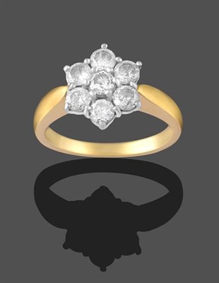 Lot 2231 - An 18 Carat Gold Diamond Cluster Ring, seven round brilliant cut diamonds, in white claw...