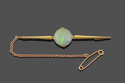 Lot 2238 - An Opal Bar Brooch, the round cabochon opal in a yellow double claw setting, to a tapering bar,...