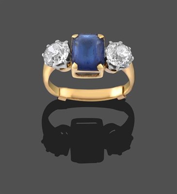 Lot 2241 - A Diamond and Blue Paste Three Stone Ring, the emerald-cut blue paste in yellow claw settings,...