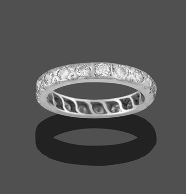 Lot 2261 - A Diamond Eternity Ring, nineteen round brilliant cut diamonds in white claw settings, total...