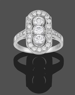 Lot 2272 - An Art Deco Style Diamond Plaque Ring, three round brilliant cut diamonds within a pierced...