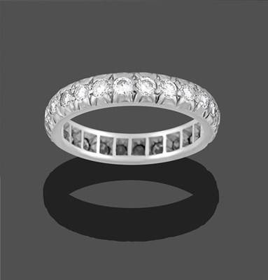 Lot 2276 - A Diamond Eternity Ring, twenty-four round brilliant cut diamonds in white rubbed over...