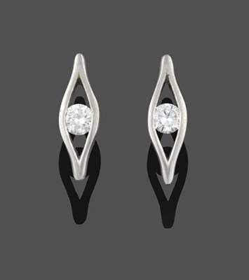 Lot 2279 - A Pair of Platinum Diamond Solitaire Earrings, the round brilliant cut diamond tension set within a
