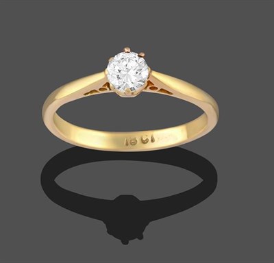 Lot 2285 - A Diamond Solitaire Ring, the round brilliant cut diamond in a yellow claw setting, to a...