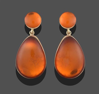 Lot 2294 - A Pair of Amber Drop Earrings, a circular cabochon amber suspends a pear shaped cabochon amber,...