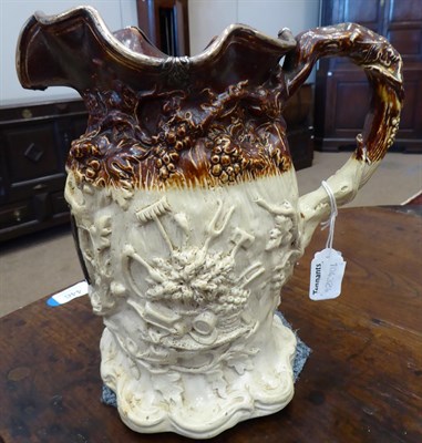 Lot 46 - A White Metal Mounted Saltglaze Stoneware Yeovil Riot Jug, circa 1831, moulded with the Royal arms