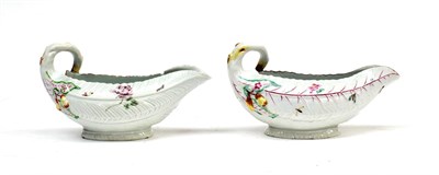 Lot 68 - A Worcester Porcelain Cos Lettuce Leaf Sauceboat, circa 1755, painted in colours with scattered...