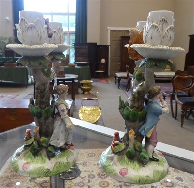 Lot 86 - A Pair of Meissen Style Figural Candelabra, circa 1900, as a boy playing pipes and a girl...
