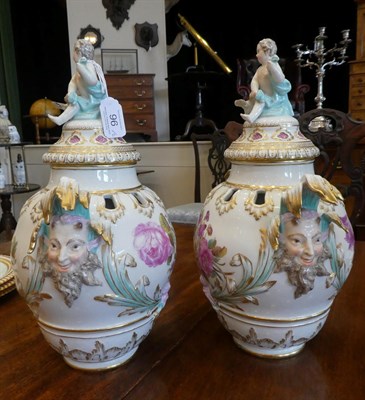 Lot 96 - A Pair of Berlin Porcelain Vases and Covers, late 19th century, of ovoid form with mask handles and