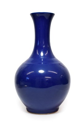 Lot 119 - A Chinese Blue Glazed Porcelain Bottle Vase, 20th century, of ovoid form with trumpet neck,...