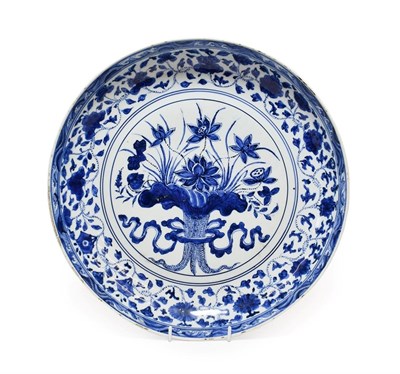 Lot 127 - A Chinese Porcelain ''Lotus Bouquet'' Dish, in Yongle style, painted in underglaze blue with a...