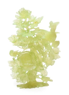 Lot 135 - A Chinese Jade Group, as a pheasant perched in a flowering lotus tree, 24cm high