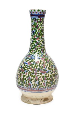 Lot 143 - A Persian Faience Bottle Vase, 19th century, of ovoid form with cylindrical neck, painted in...