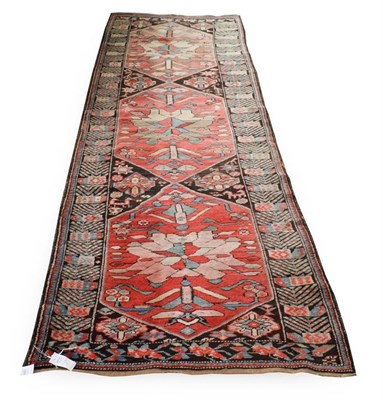Lot 185 - Karabagh Runner  South Caucasus, circa 1900 The charcoal field with three hexagons containing...