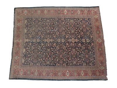 Lot 186 - Mahal Carpet West Iran, circa 1920 The deep indigo field with columns of large serrated leaves...