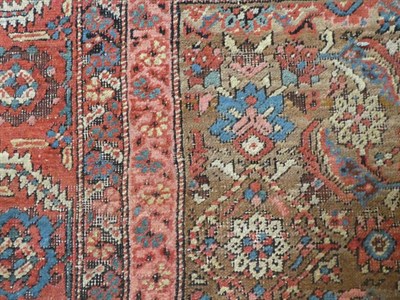 Lot 187 - Bakshaish Carpet North West Iran, circa 1880 The walnut brown Herati field enclosed by brick...