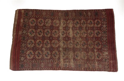 Lot 189 - Tekke Turkmen Carpet Emirate of Bukhara, circa 1880 The madder field with four rows of ten...