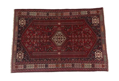 Lot 191 - Kashgai Rug South West Iran, circa 1960 The blood red field of tribal devices around a stepped...