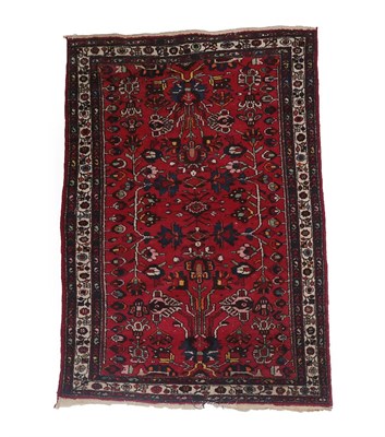 Lot 198 - Persian Hamadan Rug West Iran, circa 1930 The blood red field of angular vines enclosed by...