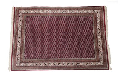 Lot 204 - Modern Indian Carpet of Serabend design The field with a one way design of boteh enclosed by...