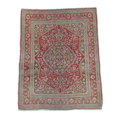 Lot 207 - Tabriz Rug North West Iran, circa 1910 The scarlet field of vines around a cusped medallion...