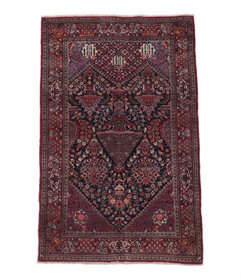 Lot 209 - Kashan Rug Central Iran, circa 1950 The angular panelled field of urns issuing flowers, enclosed by