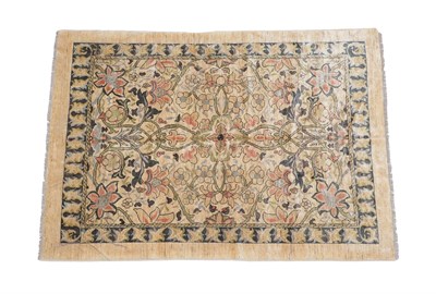 Lot 211 - William Morris Design Carpet, modern The ivory field with large scrolling vines enclosed by borders