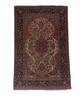 Lot 214 - Isfahan Rug  Central Iran, circa 1920 The ivory field of vines around a pole medallion framed...