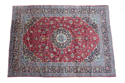 Lot 216 - Mashad Carpet North East Iran, C20th The raspberry field of vines around an indigo medallion framed