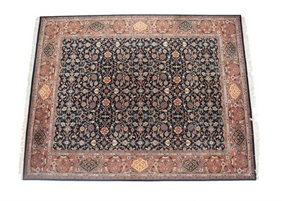 Lot 220 - Modern Indian Carpet The deep indigo field of palmettes and scrolling floral vines enclosed by...