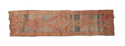 Lot 228 - Ushak Runner  Central/West Anatolia, circa 1900 The abrashed ice blue field with columns of...