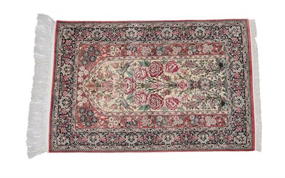 Lot 230 - Modern Signed Ghom Silk Rug Central Iran,  The cream field with naturalistic roses and birds...