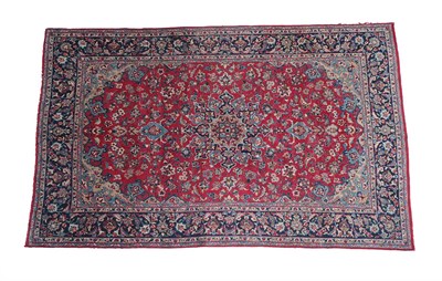 Lot 231 - Kashan Carpet Central Iran, circa 1970 The blood red field of vines around a medallion framed...