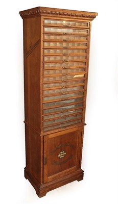 Lot 244 - A German Oak Shop Display Cabinet, early 20th century, the cornice with egg and dart moulding,...