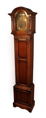 Lot 245 - An Oak Chiming Small Longcase Clock, circa 1920, arch pediment, side sound frets, front door with a