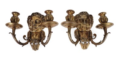 Lot 274 - A Pair of Cast Brass Twin-Light Wall Lights, in 17th century style, with Bacchic masks issuing...