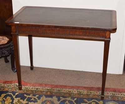 Lot 296 - A George III Mahogany Side Table, late 19th century, the worn leather writing surface above a...