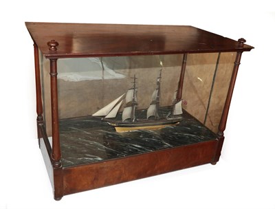 Lot 298 - A Ship's Diorama, late 19th century, as a three-masted sailing ship in rough seas, in a glazed...