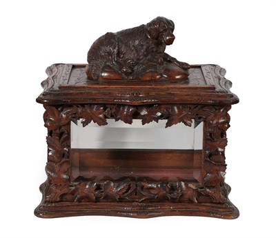 Lot 307 - A French Carved Oak Casket, mid 19th century, of shaped rectangular form, surmounted by a recumbent