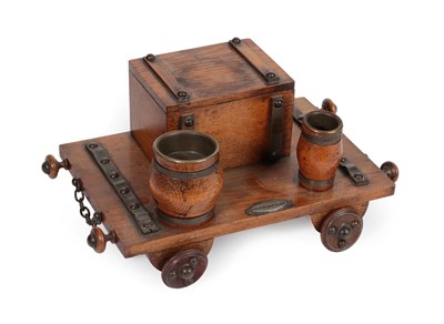 Lot 310 - A Metal Mounted Oak Novelty Desk Stand, early 20th century, modelled as a railway cart with a...