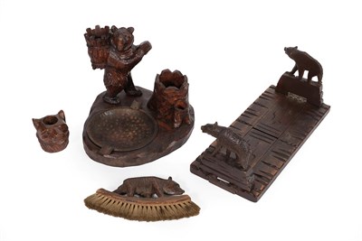 Lot 335 - A Black Forest Type Carved Smoker's Stand, late 19th/early 20th century, modelled as a bear...