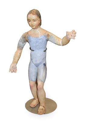 Lot 370 - A Neapolitan Crib Figure, 18th century, as a standing youth wearing a blue foundation garment, left