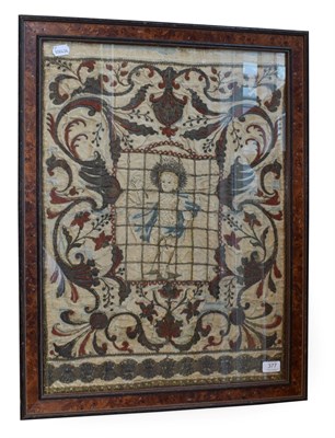 Lot 377 - A Silkwork Panel, 17th century, worked in coloured thread and coral beads with the young Christ...